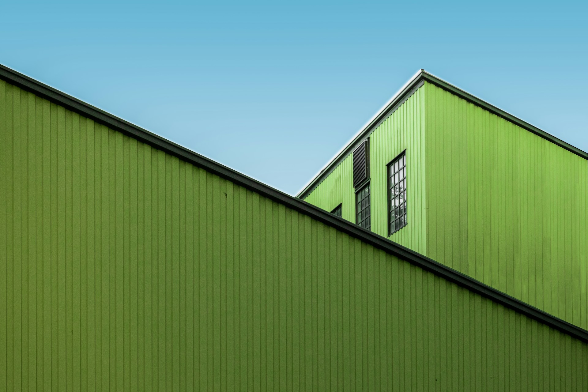 green and white wooden house under blue sky during daytime