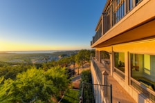 View from the suite balcony showing the vibrant Goan landscape at sunset.