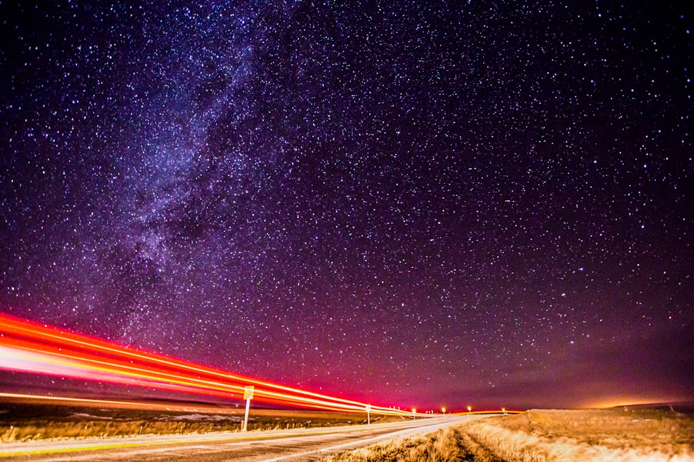 time lapse photography of cars on road during night time