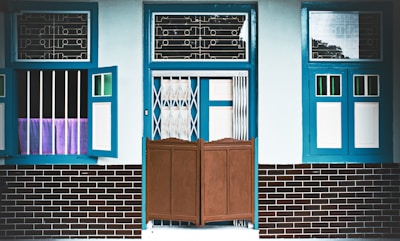 A house facade showcasing a bold mix of blue and white exterior paint.