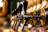 Close-up of gleaming beer lines and taps ready for service.