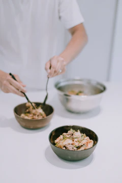 A volunteer preparing fresh food bowls inside the hedgehog rescue center.