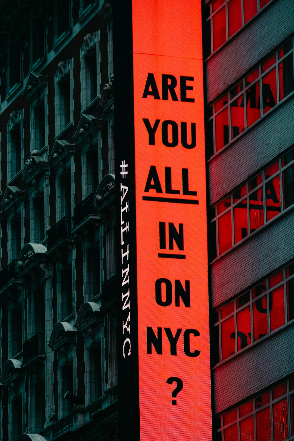 a red sign that says are you all in on nyc?
