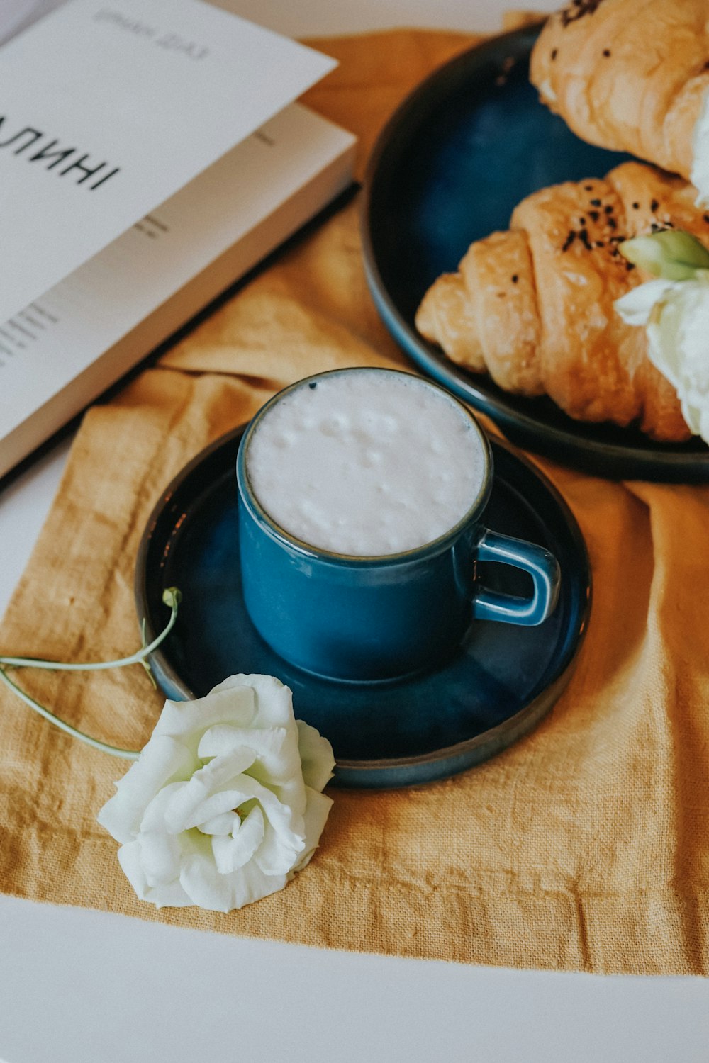 blue ceramic mug on black saucer