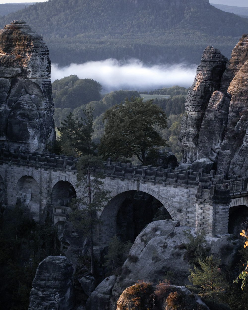 gray concrete bridge over the river