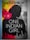 A book cover featuring the silhouette of a woman's profile against a background divided into red and gray sections. The title 'One Indian Girl' is prominently displayed in large white letters, and the author's name is at the top in bold text. There are abstract graphics and faint images of cityscapes along the bottom edge.
