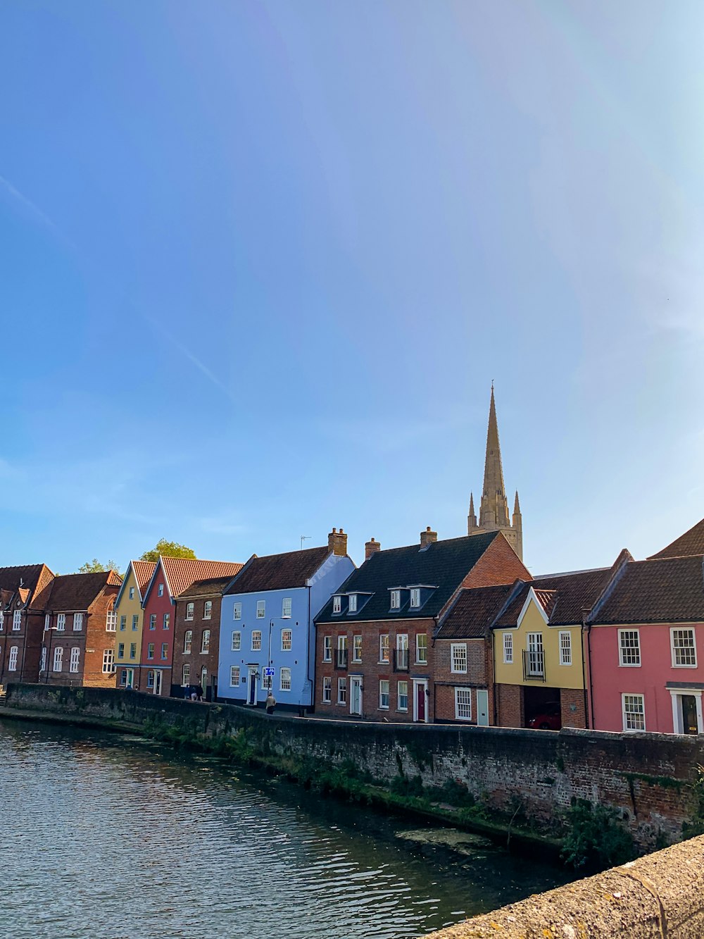 houses near body of water during daytime