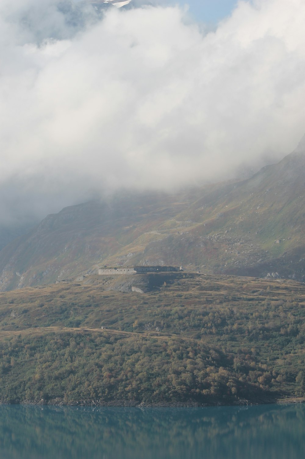 green and brown mountains under white clouds during daytime