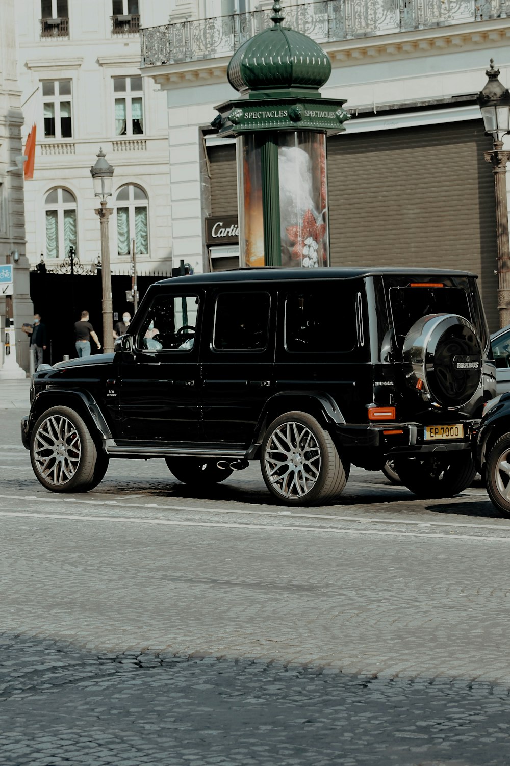 black suv on road during daytime