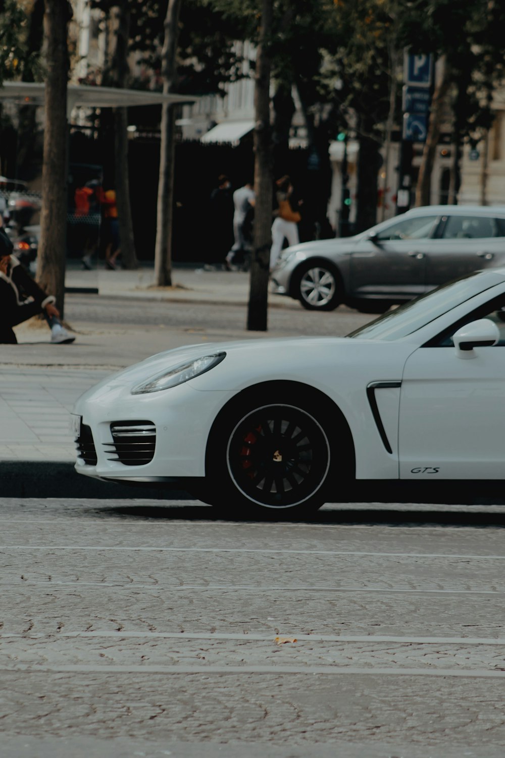 white porsche 911 on road during daytime