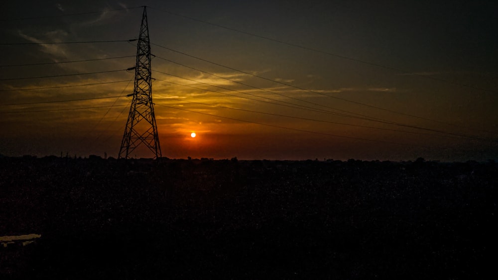 silhouette of tower during sunset