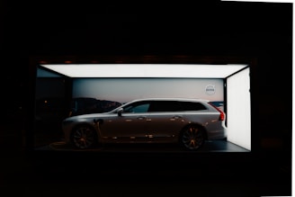 white sedan parked in garage