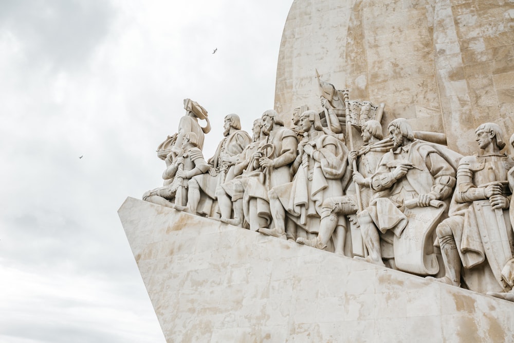 gray concrete statue under white sky during daytime