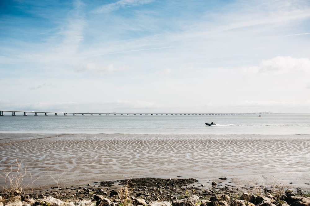 body of water under blue sky during daytime