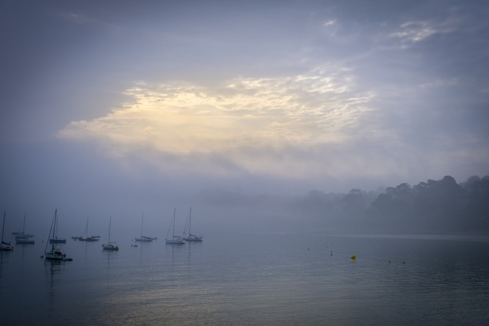 boat on sea under cloudy sky during daytime