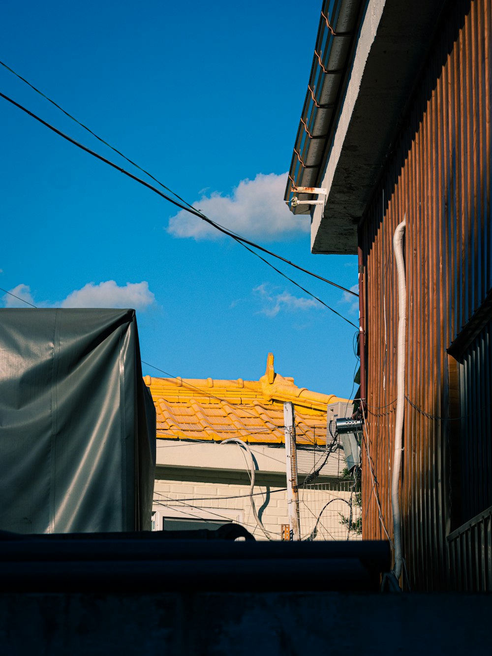 white and brown house under blue sky during daytime