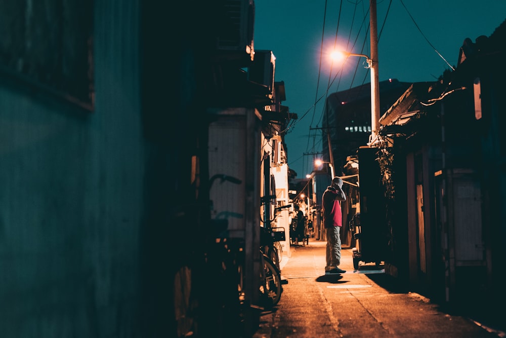 people walking on street during night time