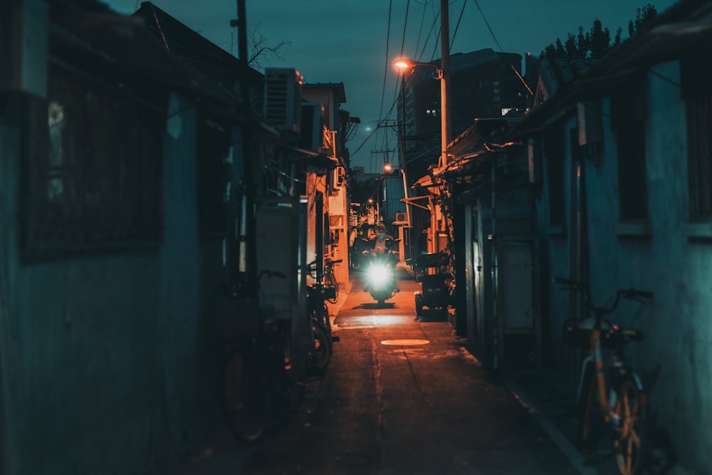 black car parked beside building during night time