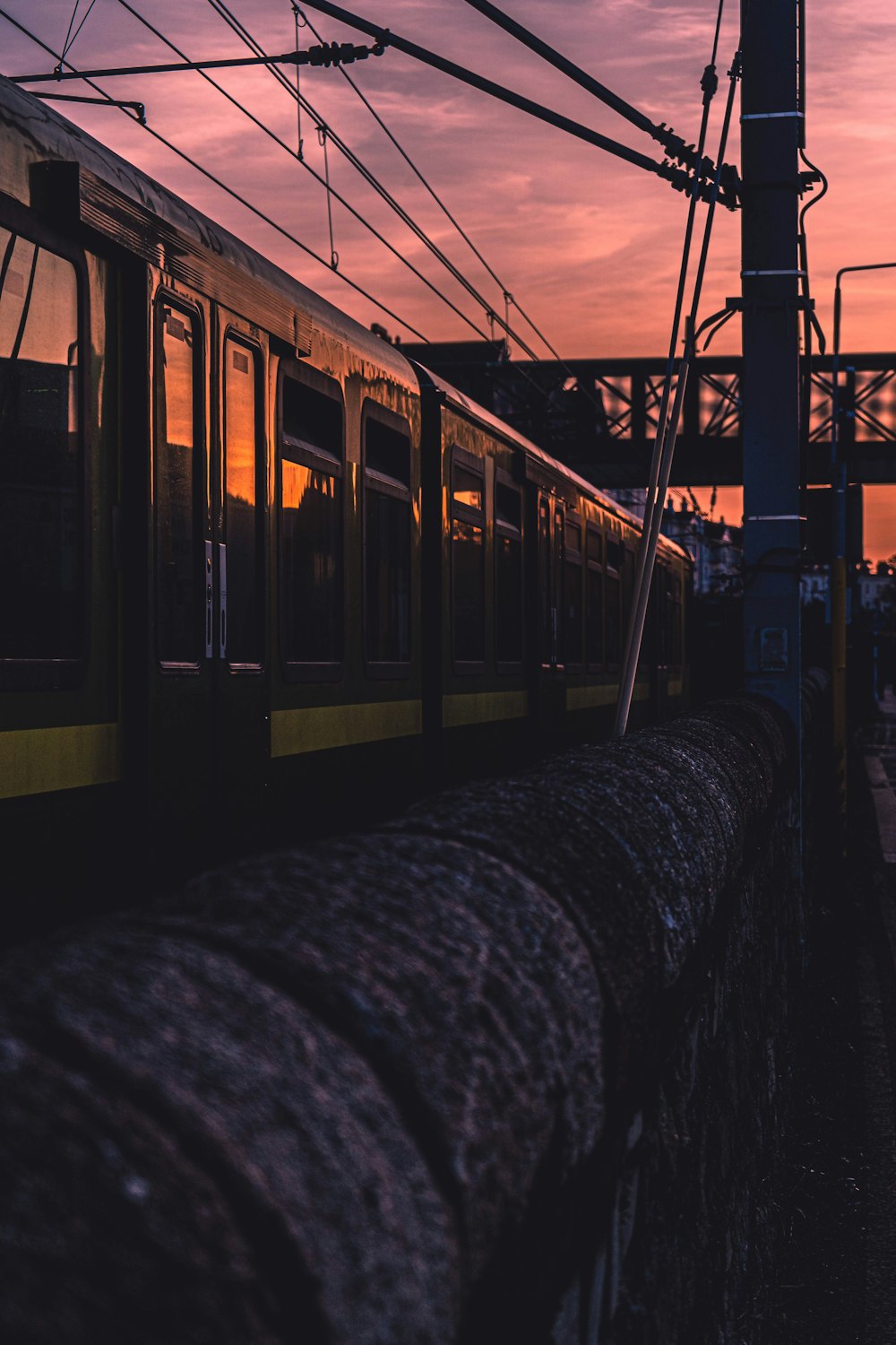 yellow and black train on rail tracks