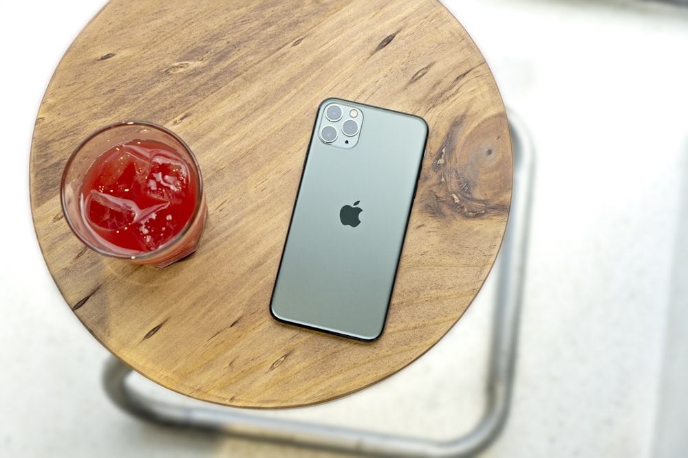 silver iphone 6 on brown wooden table