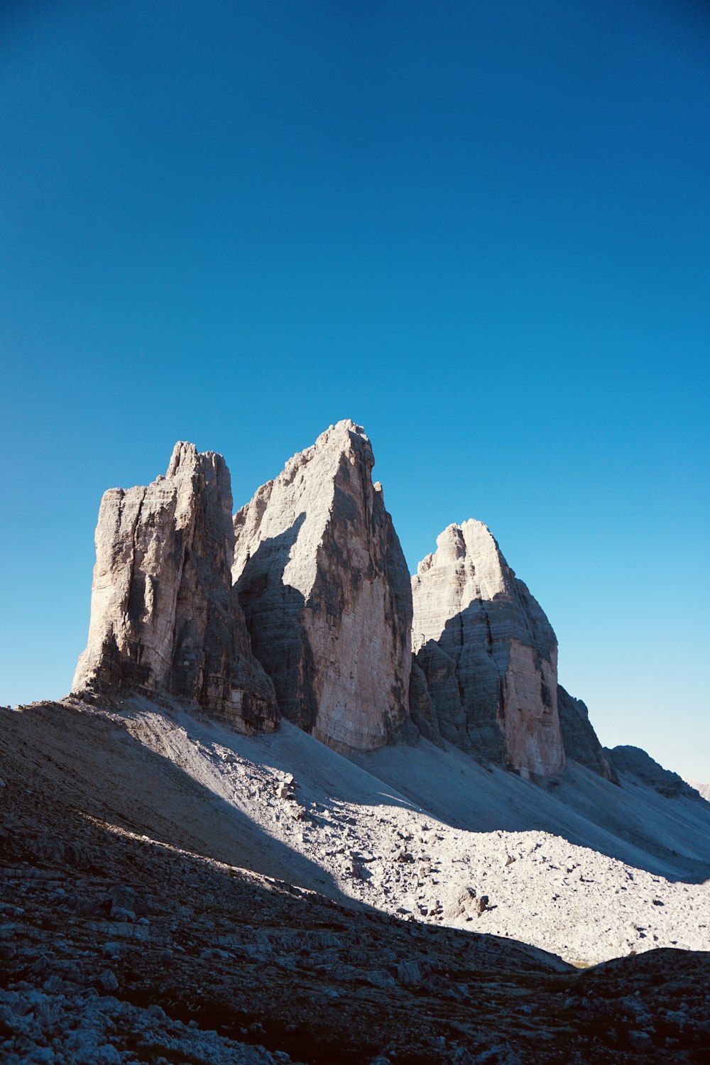 brown rocky mountain under blue sky during daytime