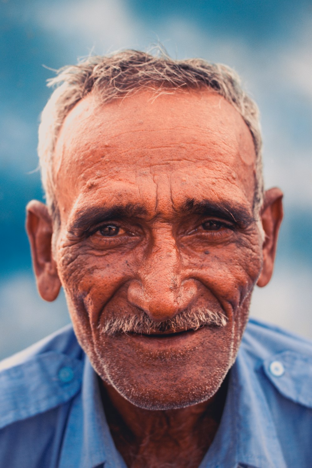 man in blue collared shirt