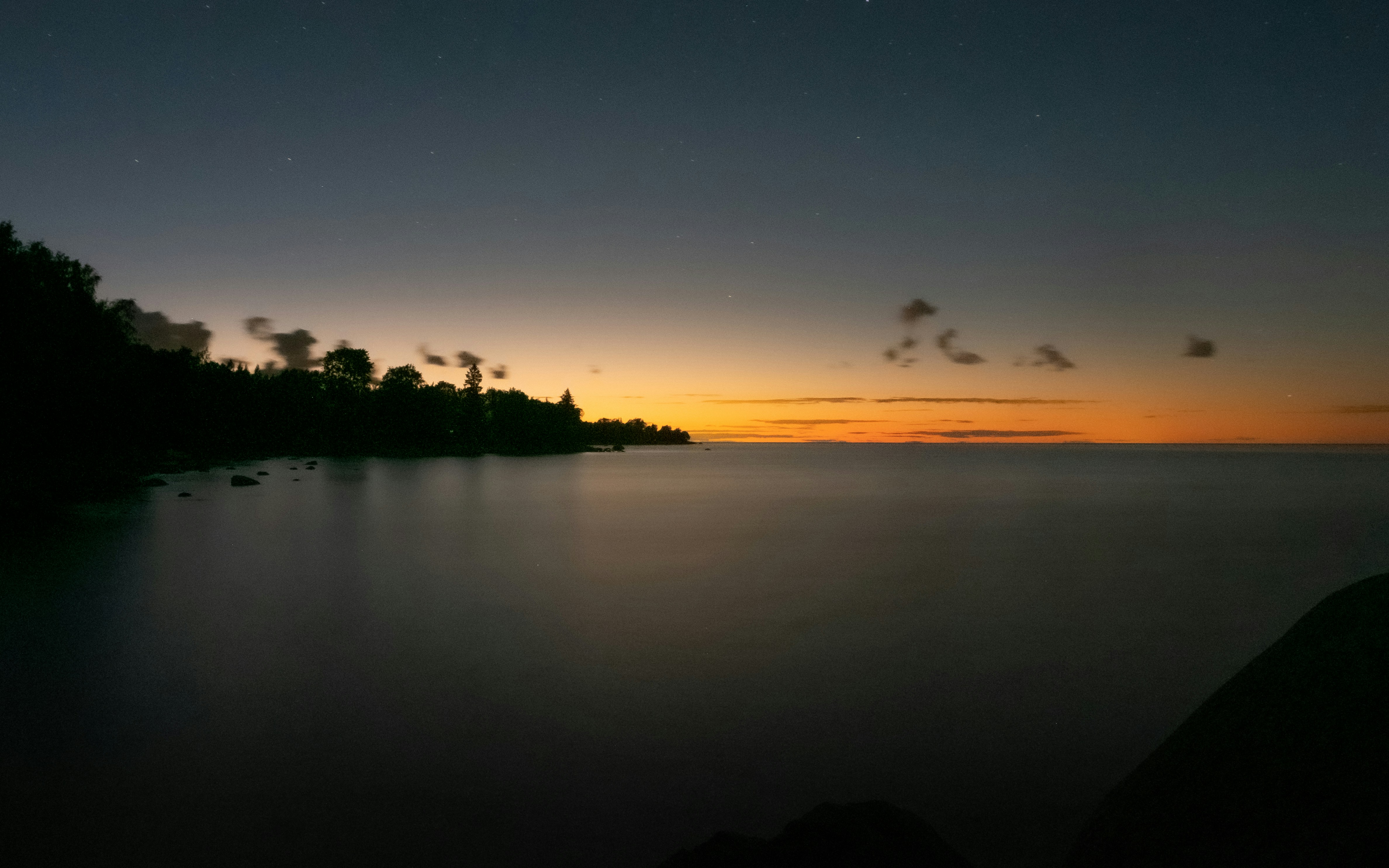 body of water during sunset