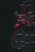 A digital map highlighting various countries in Europe and Africa with red dots indicating specific points of interest. The map is dark-themed with bright red markers concentrated around major cities.
