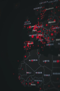 A digital map highlighting various countries in Europe and Africa with red dots indicating specific points of interest. The map is dark-themed with bright red markers concentrated around major cities.