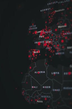 A digital map highlighting various countries in Europe and Africa with red dots indicating specific points of interest. The map is dark-themed with bright red markers concentrated around major cities.