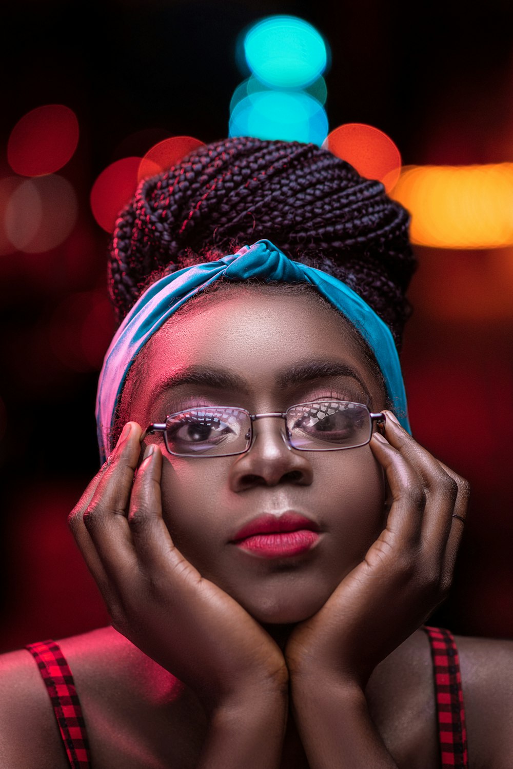 woman in blue knit cap and black framed eyeglasses