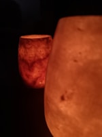 Elegant acacia wood candle holders glowing softly in warm light.