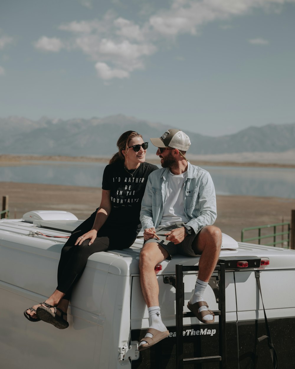 man in black crew neck t-shirt sitting on white boat during daytime