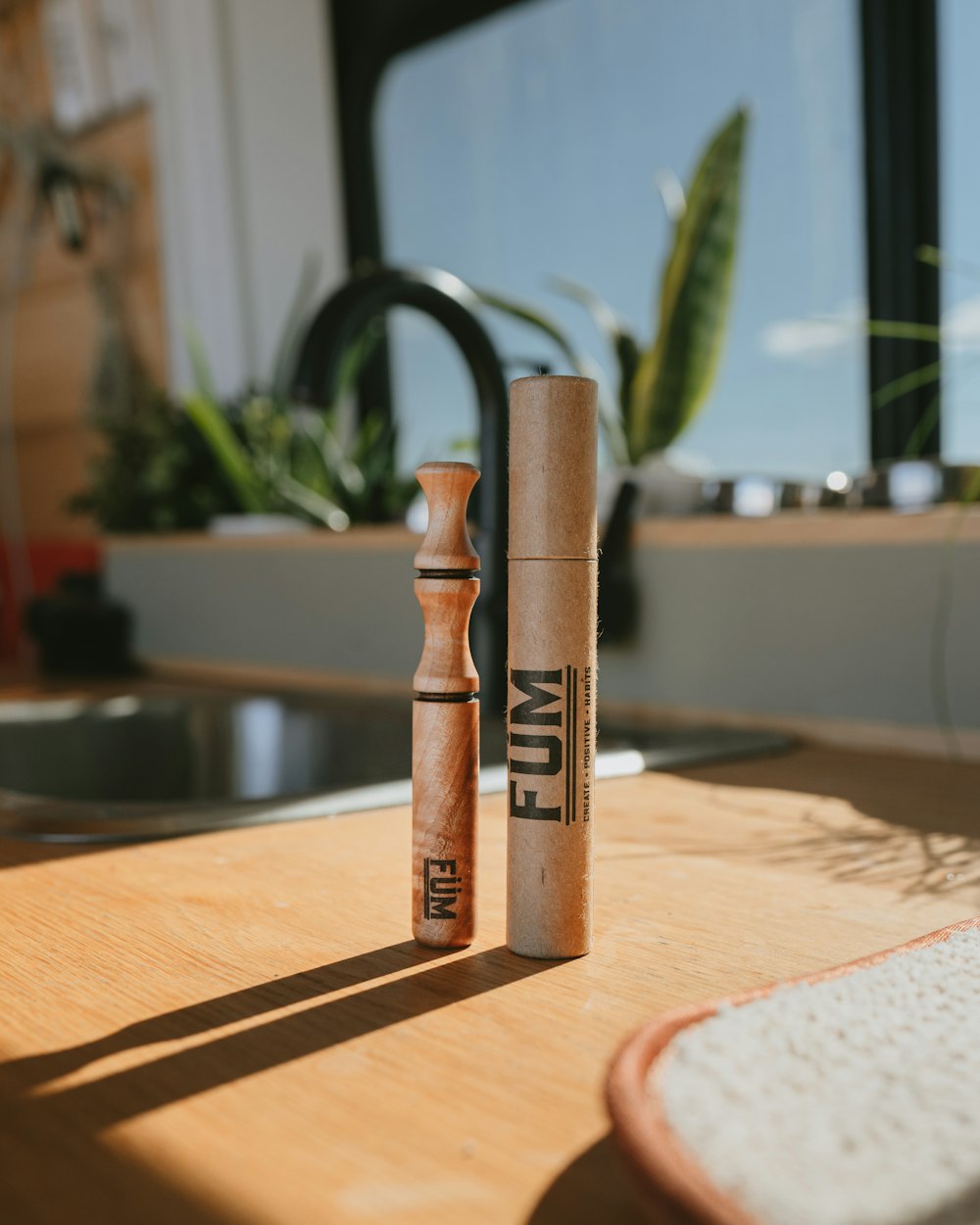 brown wooden rolling pin on brown wooden table