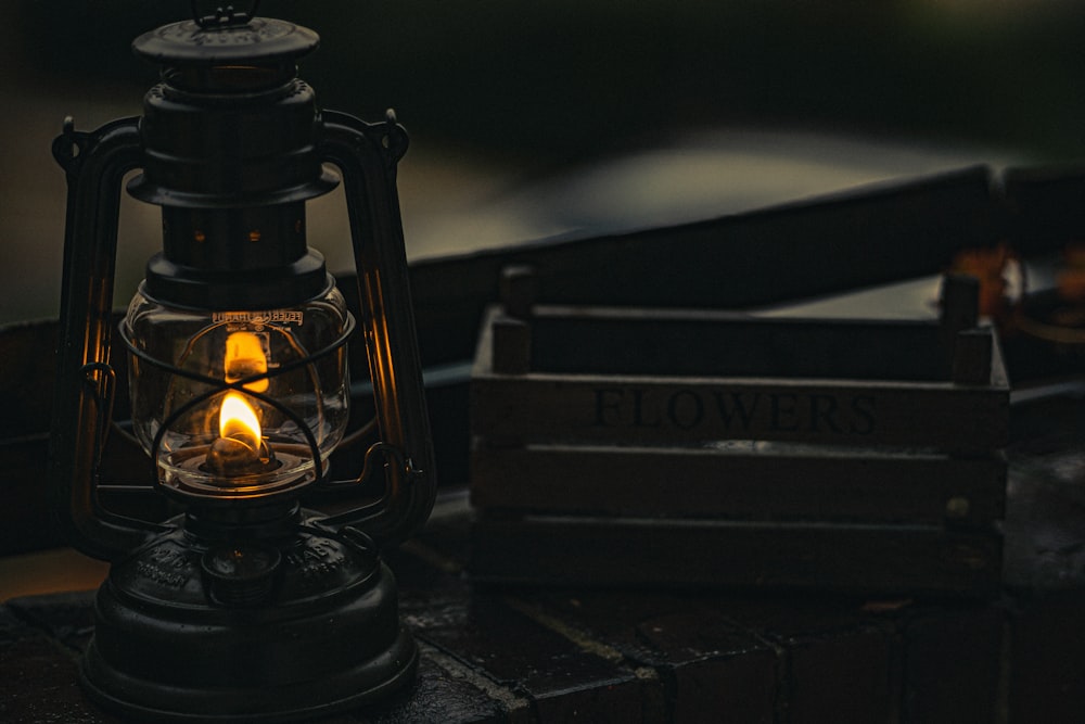 black lantern on black wooden table