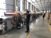 Industrial dehumidifiers and water extraction machines in operation, professional lighting, clean dark background.