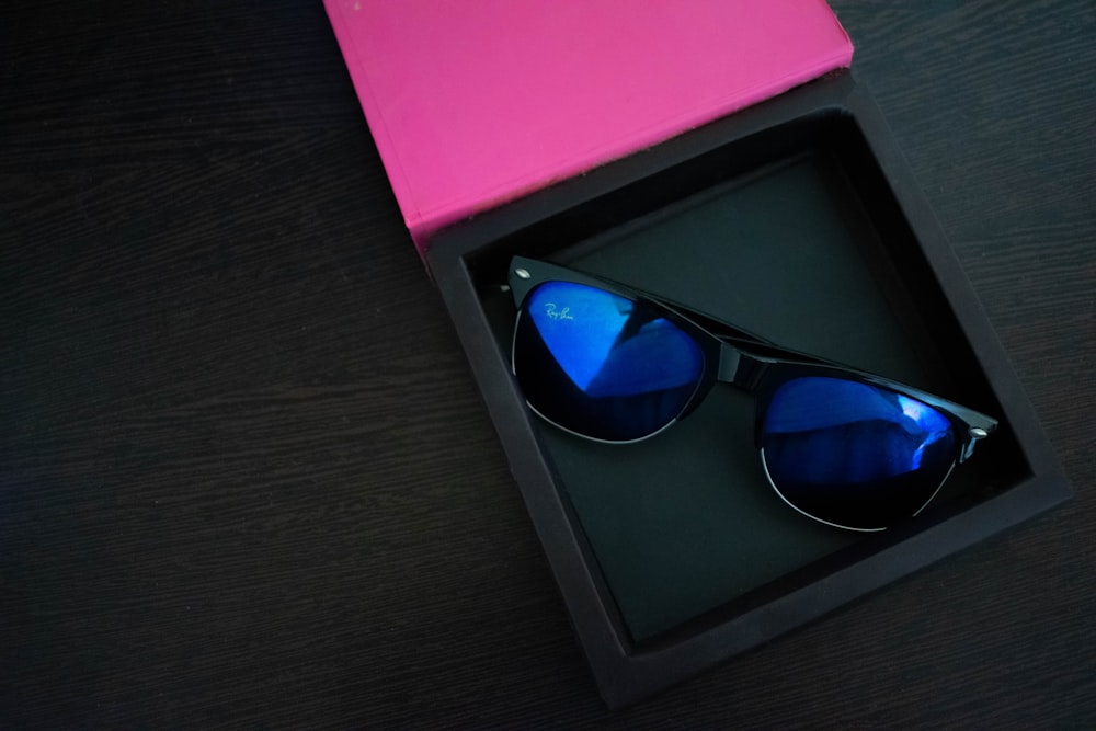 a pair of sunglasses sitting inside of a box