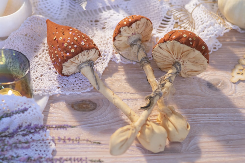brown and white mushrooms on white textile