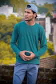 An outdoor shot of someone wearing a relaxed-fit tee paired with jeans.