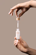 Close-up of the Clarity Ritual dosing system in action beside an aquarium