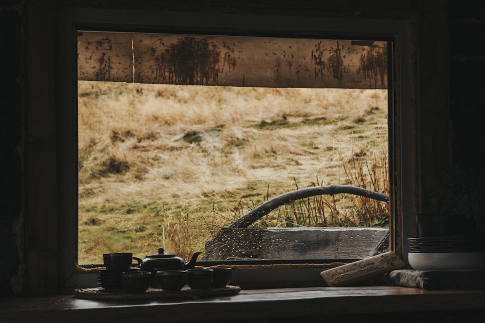 black metal wheel on brown wooden plank