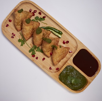 brown wooden tray with food