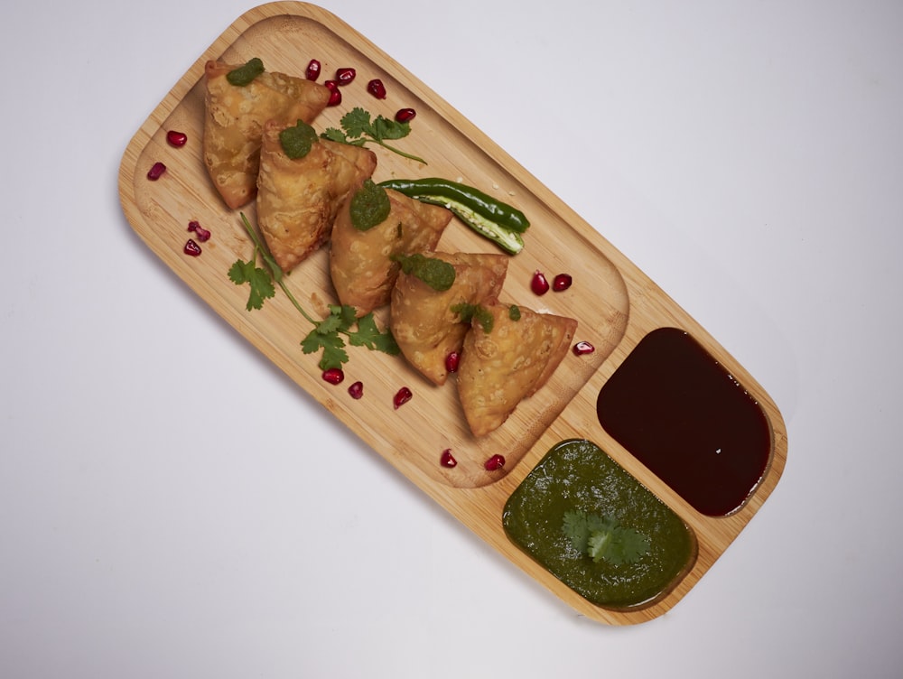 brown wooden tray with food