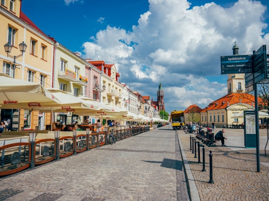 people walking on street near buildings during daytime in Esperanto Cafe Poland