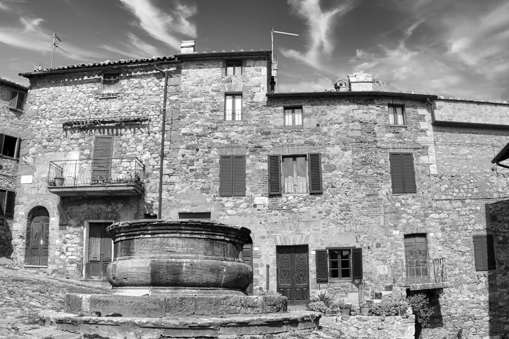 grayscale photo of brick building