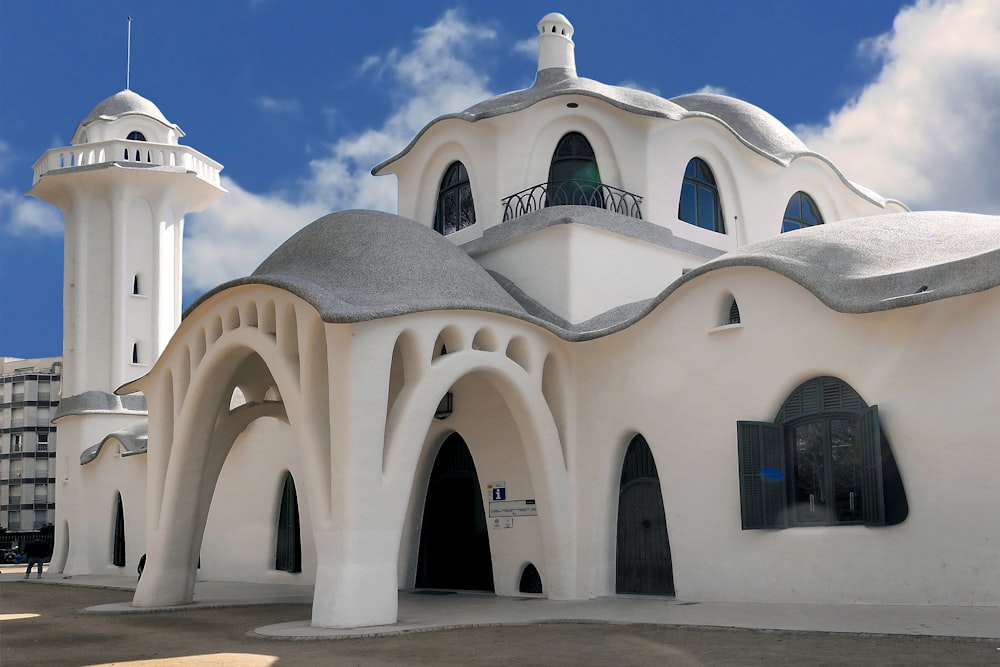 white concrete building under blue sky during daytime