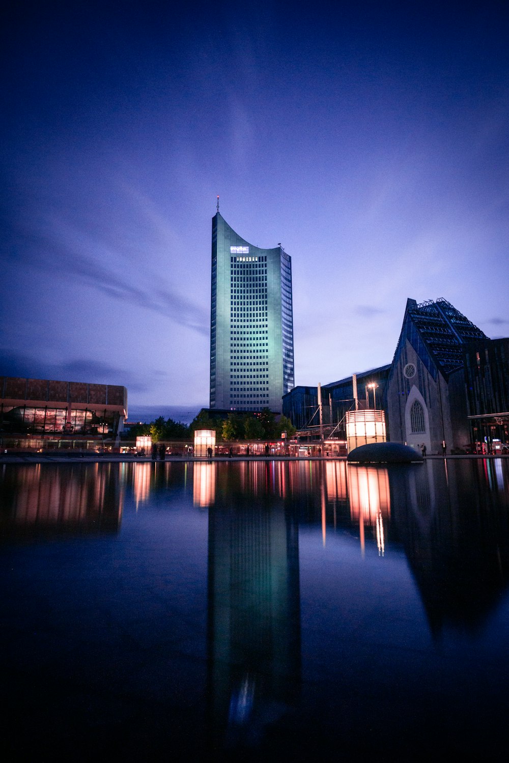 body of water near building during night time