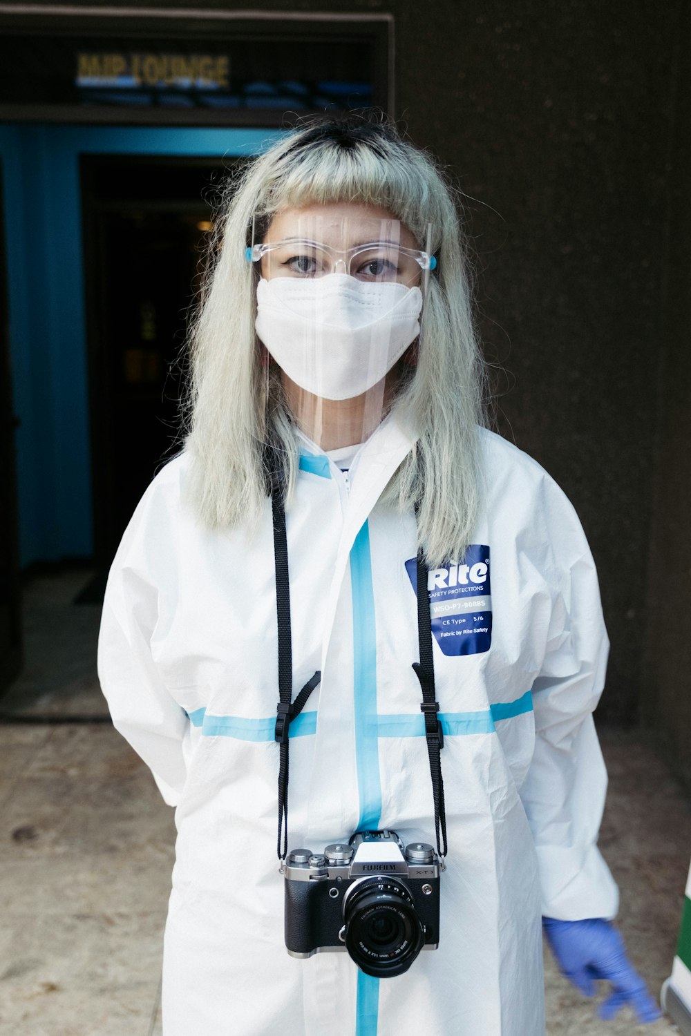 woman in white long sleeve shirt wearing white face mask