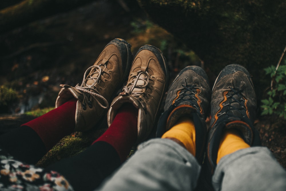 person wearing brown hiking shoes