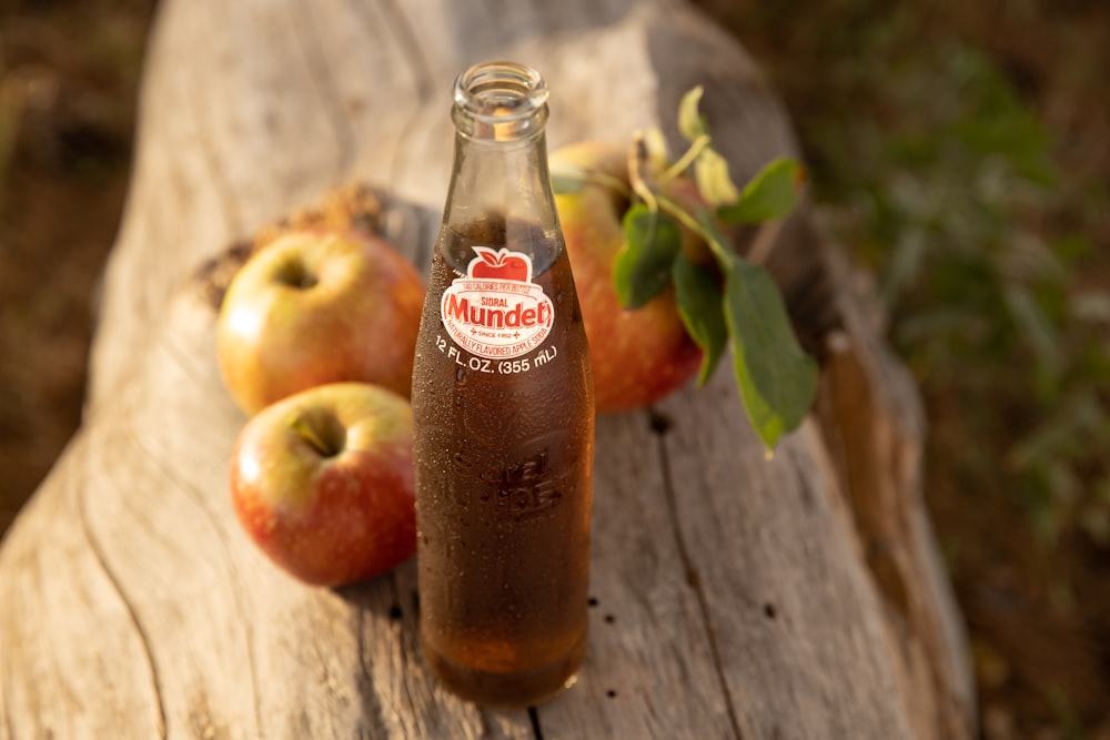 clear glass bottle with red liquid inside